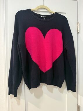 Kerri Rosenthal of Aqua Navy Sweater with Pink Heart Graphic